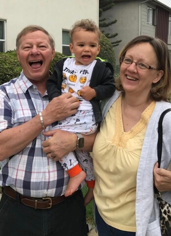 Arnold Dorsey with his wife and grandson.